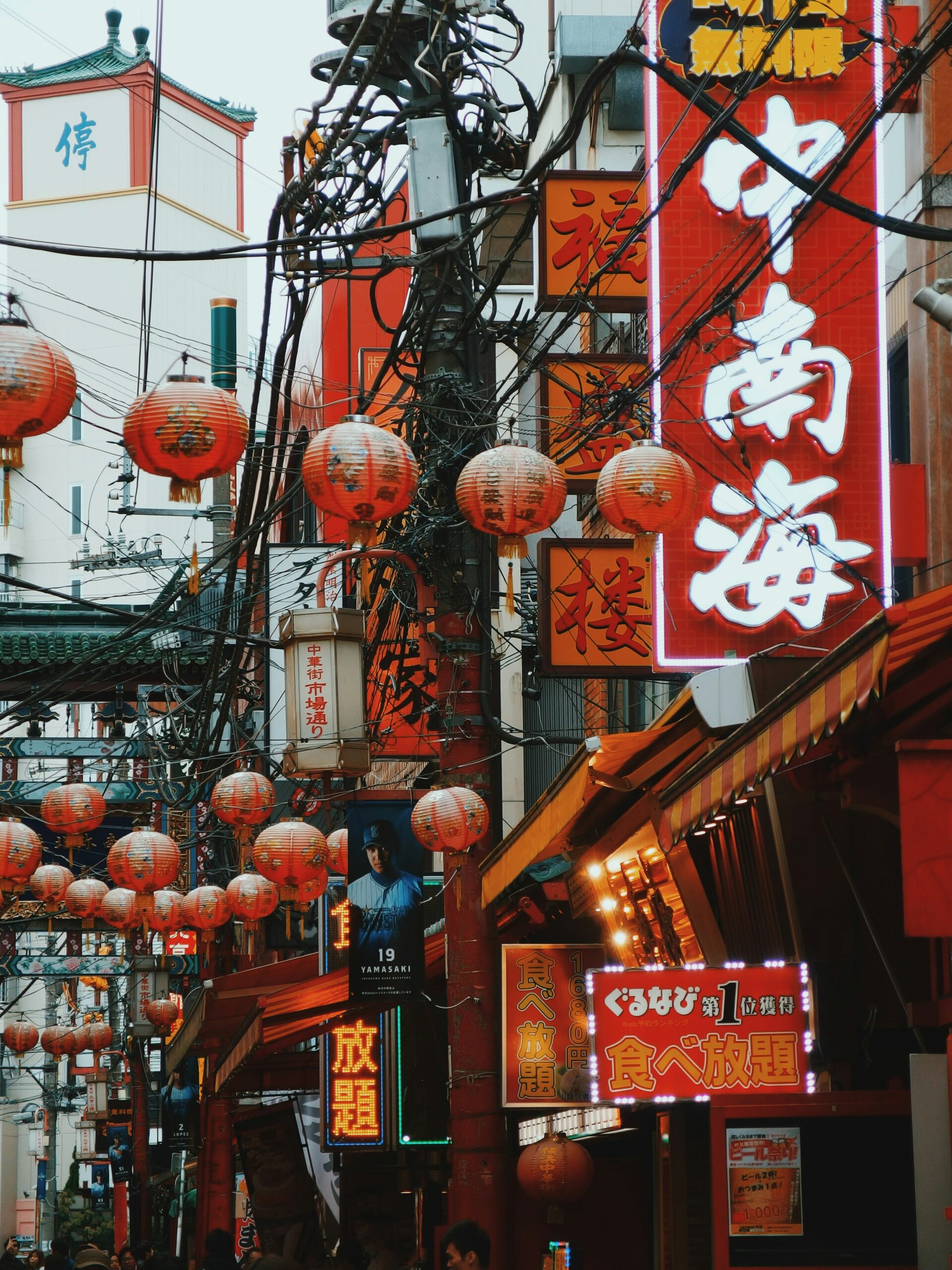 Asian street market at dusk with red lanterns